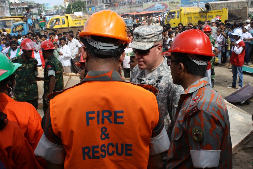 Sgt. 1st Class Lee speaks with Bangladesh Fire and Civil defense staff