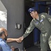 Lt. Col. Caesar Garduno shakes Rodolfo Hernandez's hand