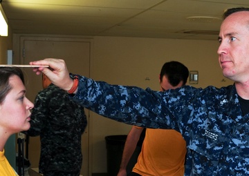 USS Ronald Reagan sailor measured for physical readiness test