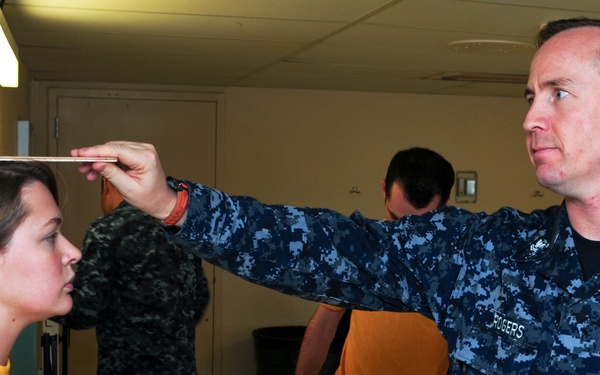 USS Ronald Reagan sailor measured for physical readiness test
