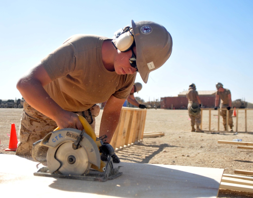 NMCB 133 Seabee cuts plywood