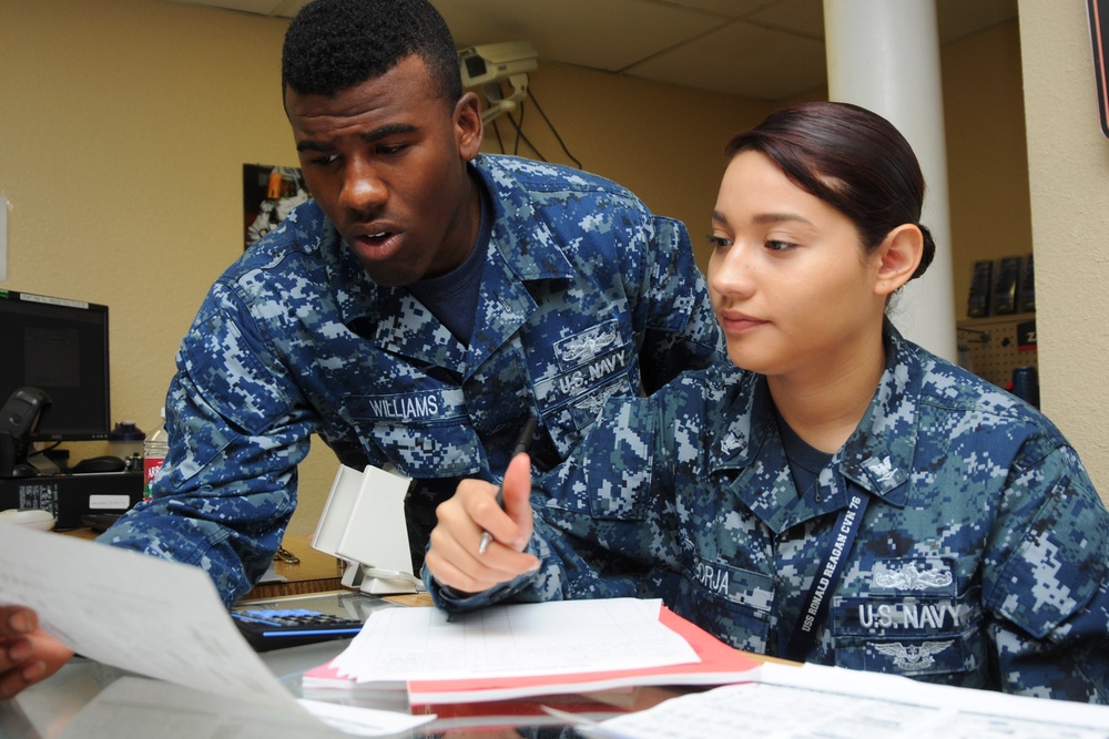 USS Ronald Reagan sailors process purchases