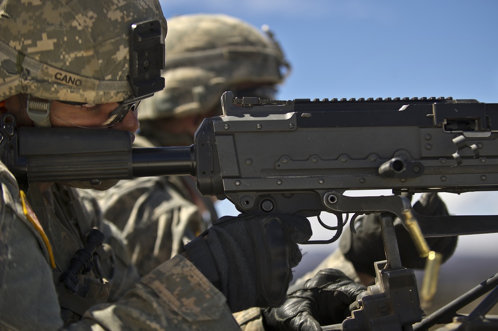 US Army machine gun crews from Alpha Company site their weapon at the firing range