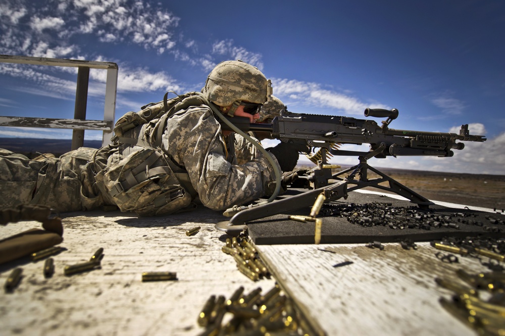US Army machine gun crews from Alpha Company site their weapon at the firing range