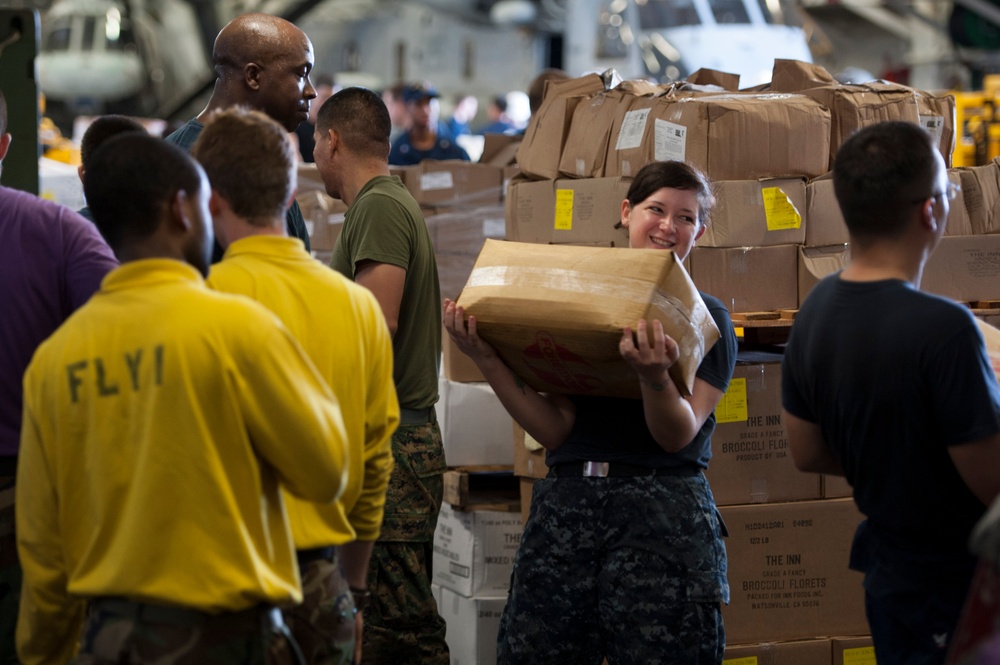 USS Bonhomme Richard sailors move supplies