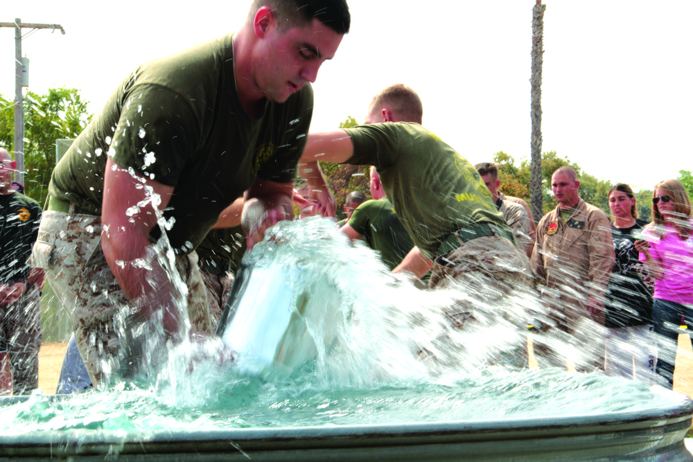 Yuma ARFF Marines cool off during fireman competition