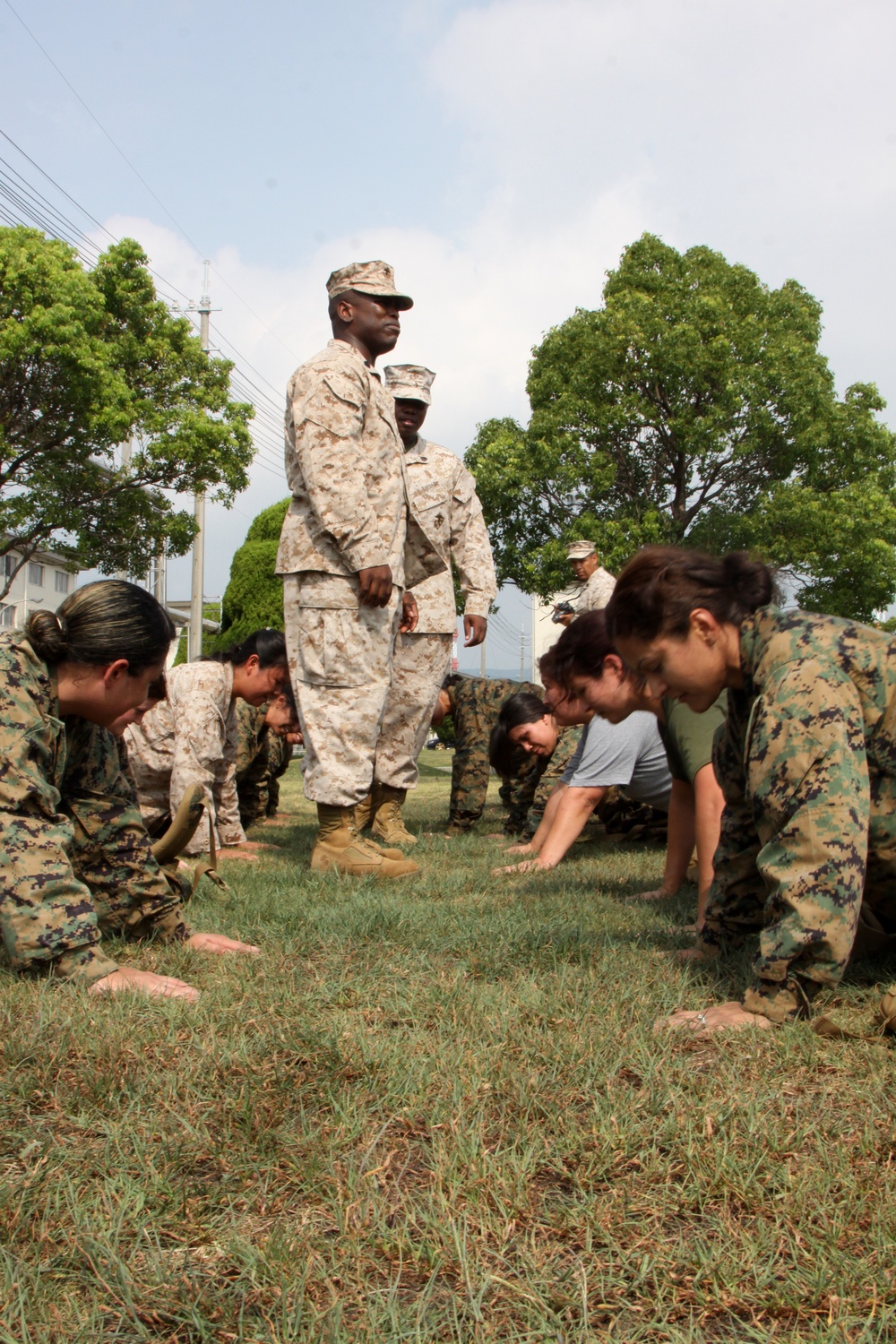 Spouses experience incentive training before conducting the combat fitness test during Jane Wayne Day here Sept. 14, 2012