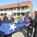 USS Fort McHenry crew raises flag