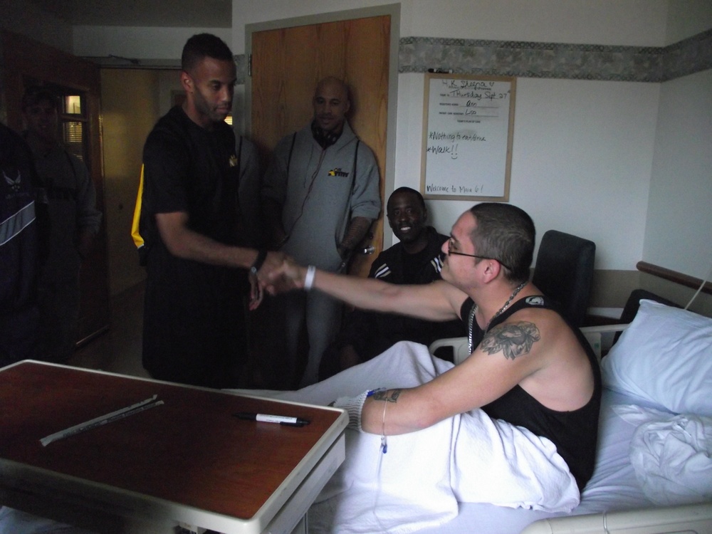 Members of the Armed Forces Taekwondo Team visit a local Taekwondo Student in the Pinnacle Community Hospital September 27