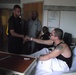 Members of the Armed Forces Taekwondo Team visit a local Taekwondo Student in the Pinnacle Community Hospital September 27