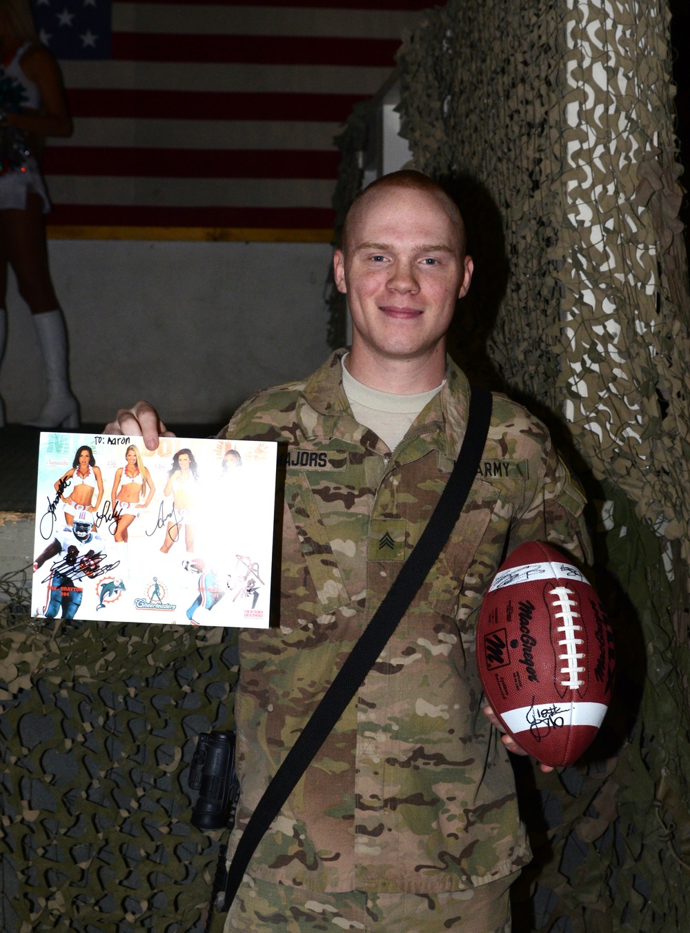 Cheer for troops: Miami Dolphins cheerleaders visit with, entertain troops at Bagram