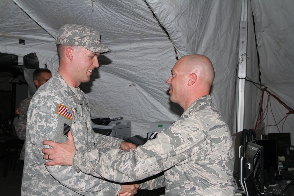 Air Force master sergeant congratulates Army staff sergeant