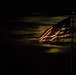 American flag lit by a full moon
