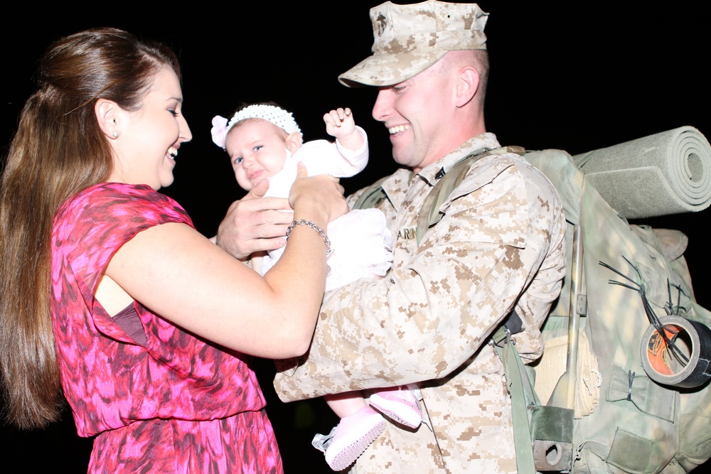 Friends and families gather to welcome Marines of 1/1 home