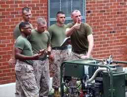 CBRN defense specialist train Marines to decontaminate with new equipment