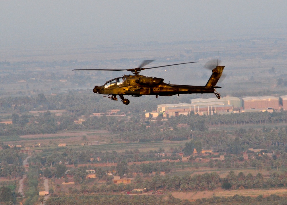 Apache flies over Iraq at sunrise