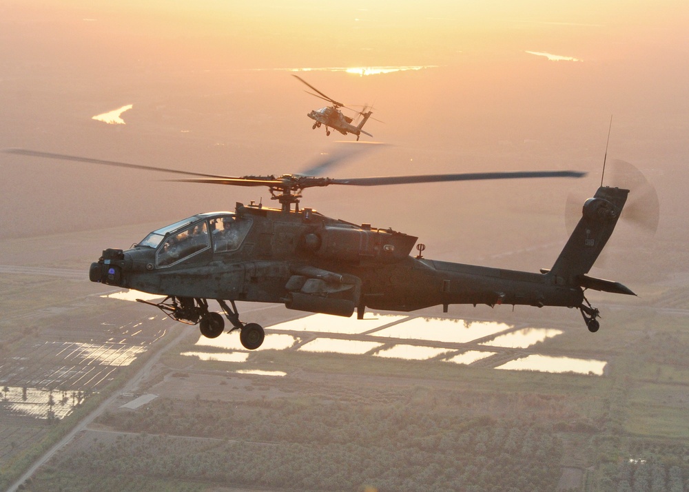 Apache flies over Iraq at sunrise