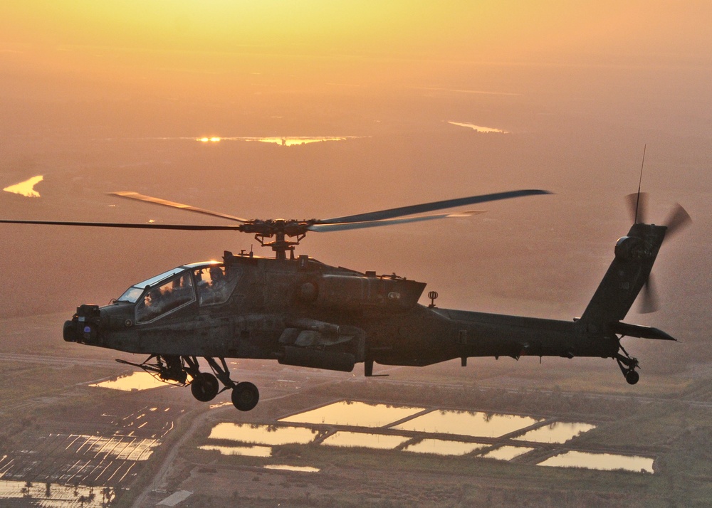 Apache flies over Iraq at sunrise