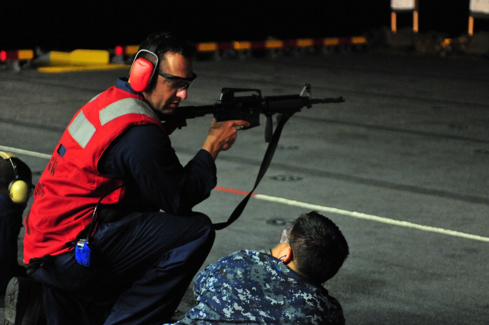 USS Boxer sailor particpates in small arms qualification shoot