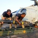 HSL 46 sailors load missiles onto a Sea Hawk