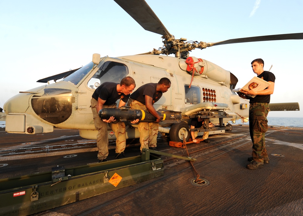 HSL 46 sailors load missiles onto a Sea Hawk