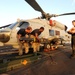 HSL 46 sailors load missiles onto a Sea Hawk