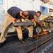 HSL 46 sailors load missiles onto a Sea Hawk