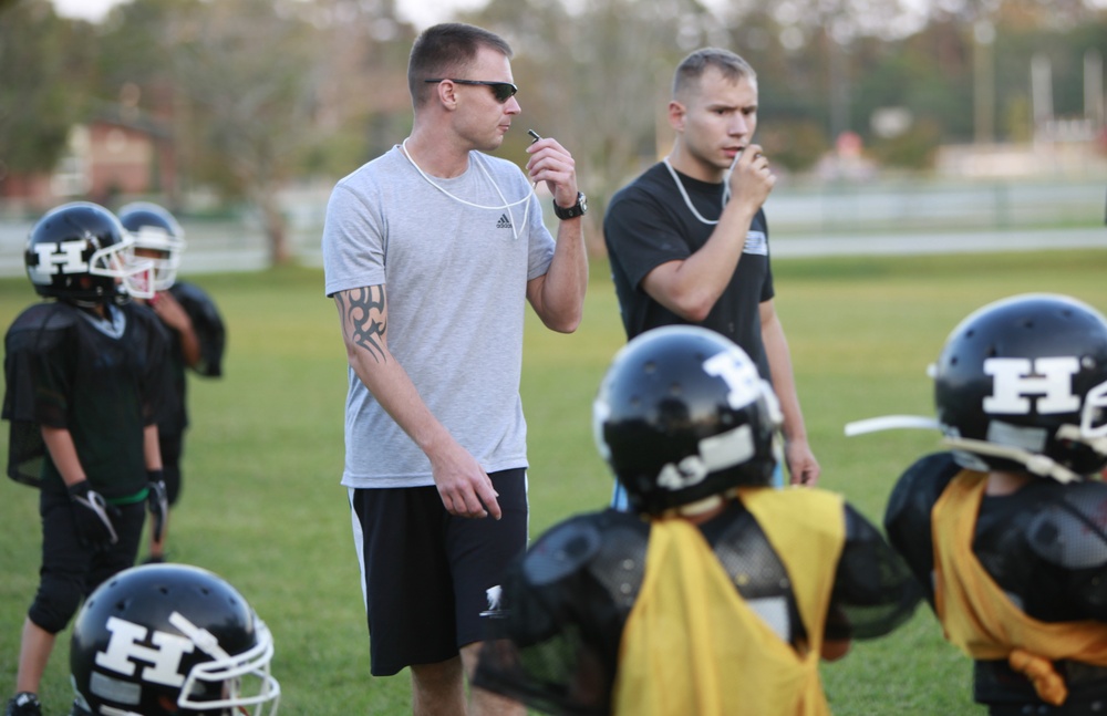 Marines volunteer free time to coaching youth football team