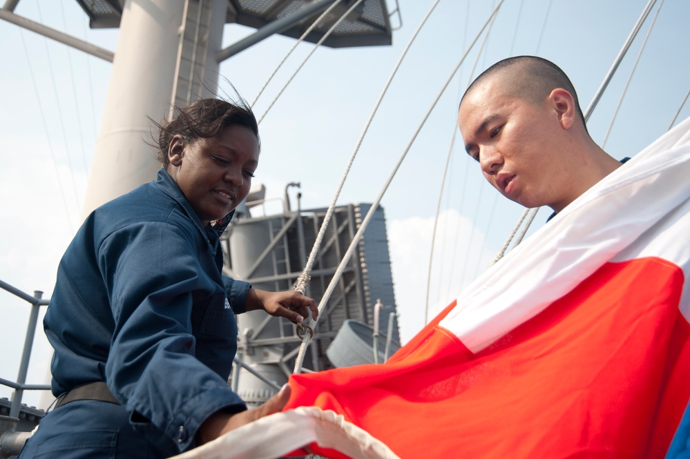 Preparing to hoist signal flags