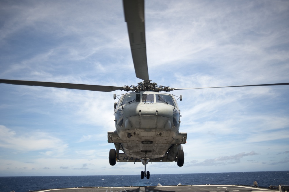 SH-60 Seahawk helicopter approaches flight deck of USS Cowpens
