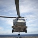 SH-60 Seahawk helicopter approaches flight deck of USS Cowpens
