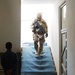 A Kentucky soldier returns from security checks on a roof in southern Afghanistan