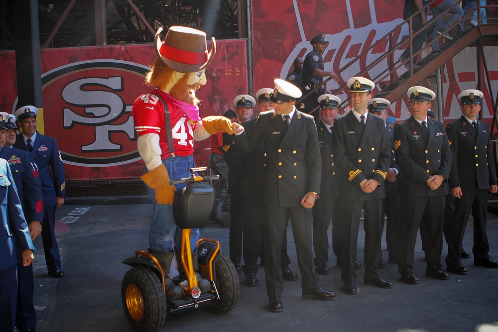 San Francisco Fleet Week military members salute at 49ers game