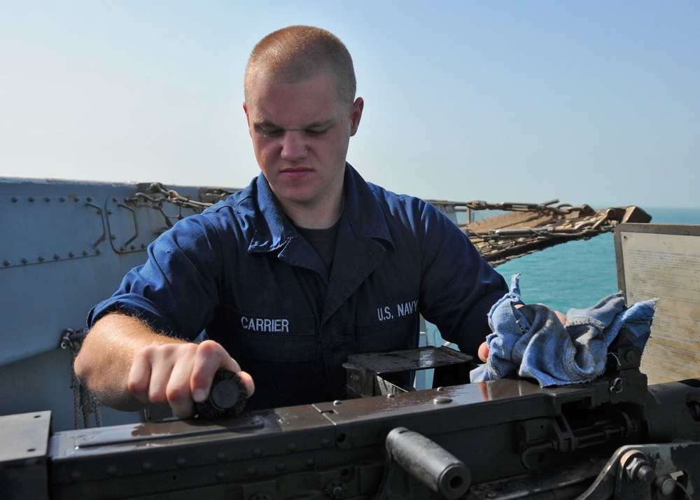 USS New York sailor performs maintenance