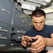 USS George H.W. Bush sailor at work