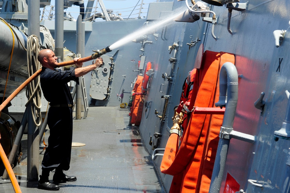 USS Farragut sailor conducts washdown