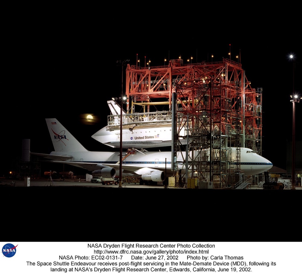 The Space Shuttle Endeavour receives post-flight servicing in the Mate-Demate Device (MDD), followin