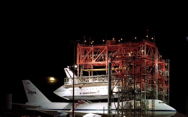 The Space Shuttle Endeavour receives post-flight servicing in the Mate-Demate Device (MDD), followin