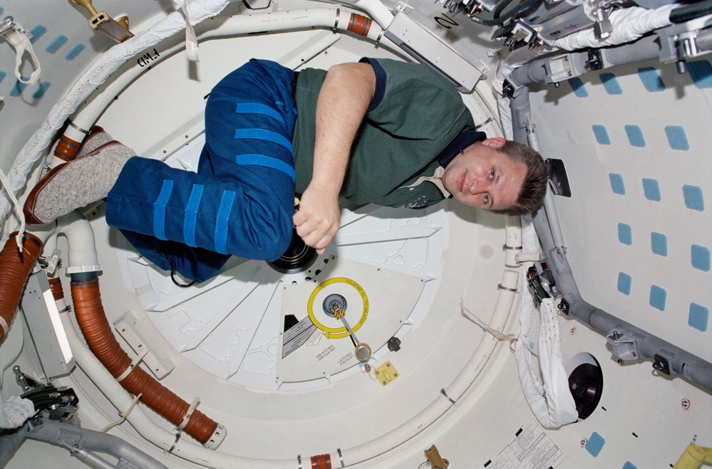 Onufrienko poses on the airlock of Endeavour during STS-108