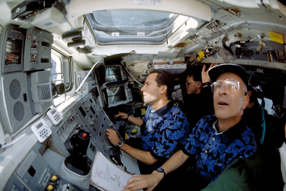 Various view with fish-eye lens of STS-103 crew on aft flight deck