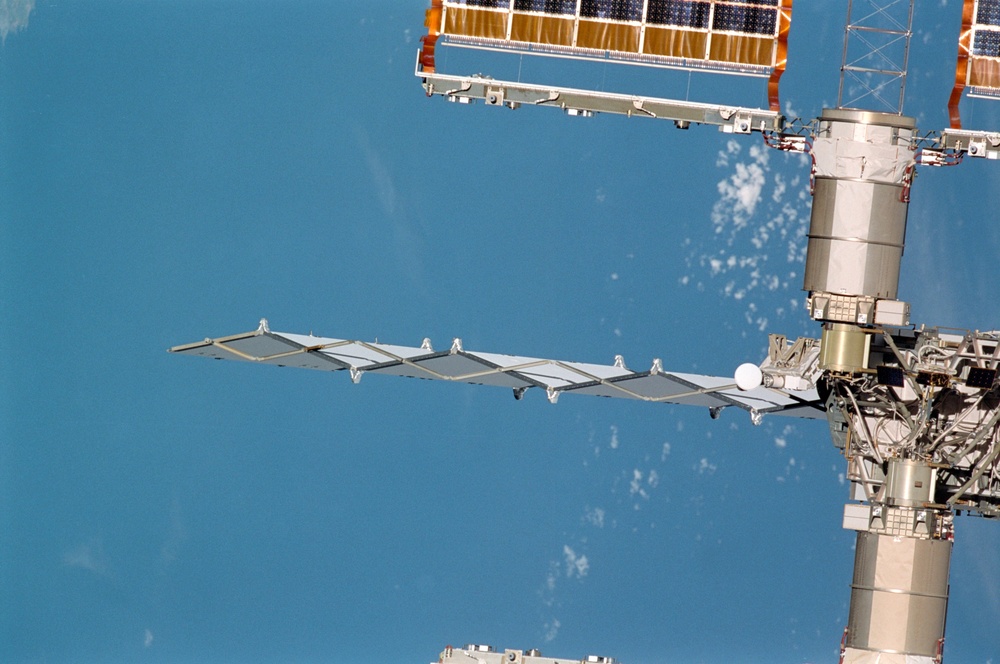 Exterior view of ISS during flyaround by STS-105 showing P6 radiator