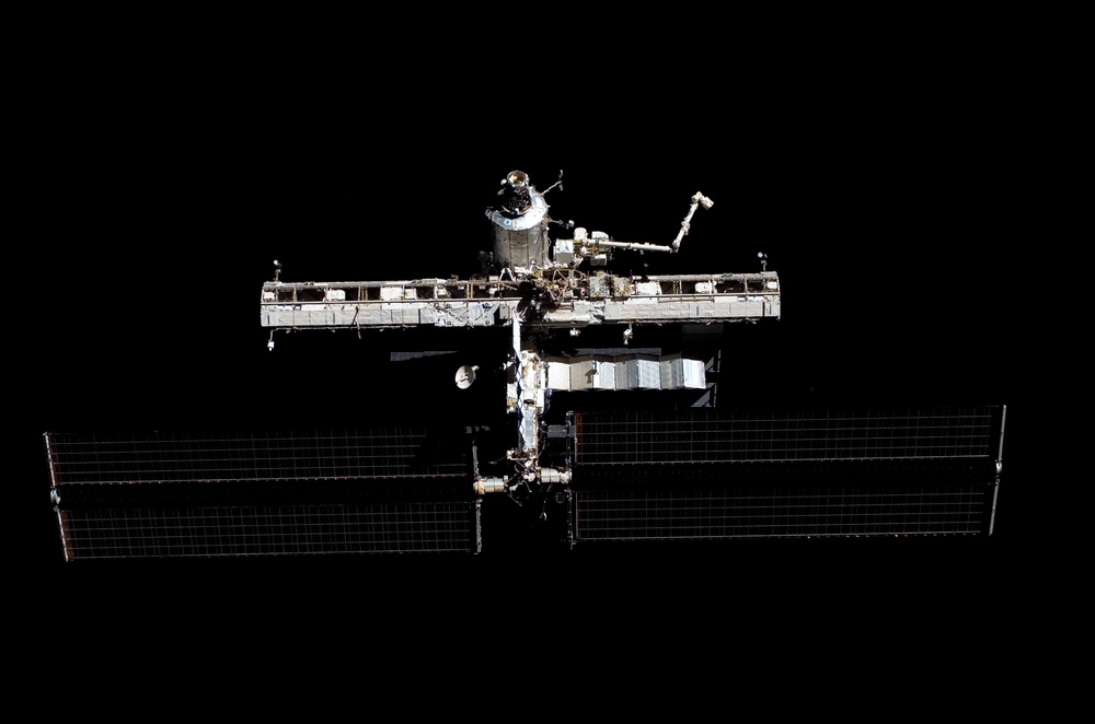 Distant view of the ISS from the orbiter during separation on STS-121