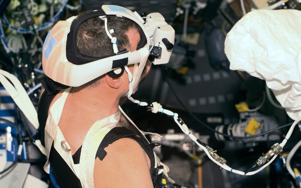 VEG - Williams in Spacelab with helmet