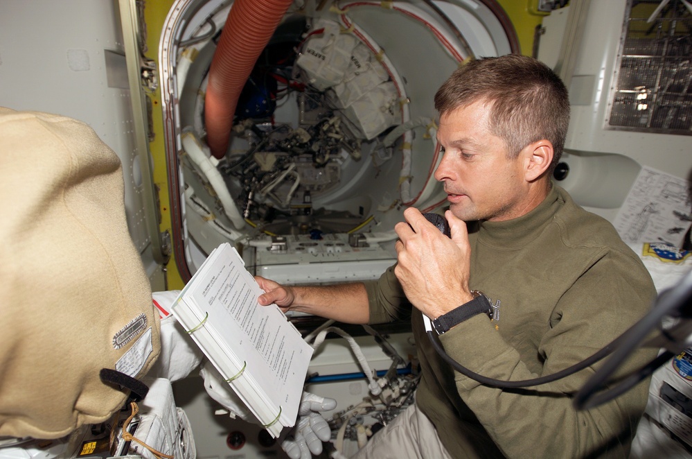 Swanson uses communication equipment in the A/L during Joint Operations