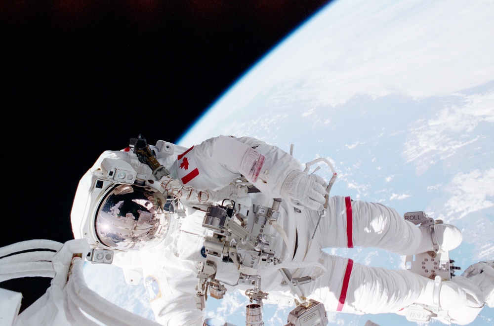 Full view of MS Hadfield in his EMU during the first EVA of STS-100