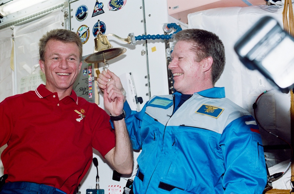 Jett and Shepherd ring the Navy bell in Node 1 during STS-97's ISS visit