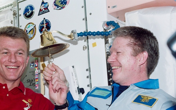 Jett and Shepherd ring the Navy bell in Node 1 during STS-97's ISS visit