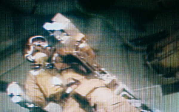 Astronaut Alan Bean flies the Astronaut Maneuvering Equipment in the OWS
