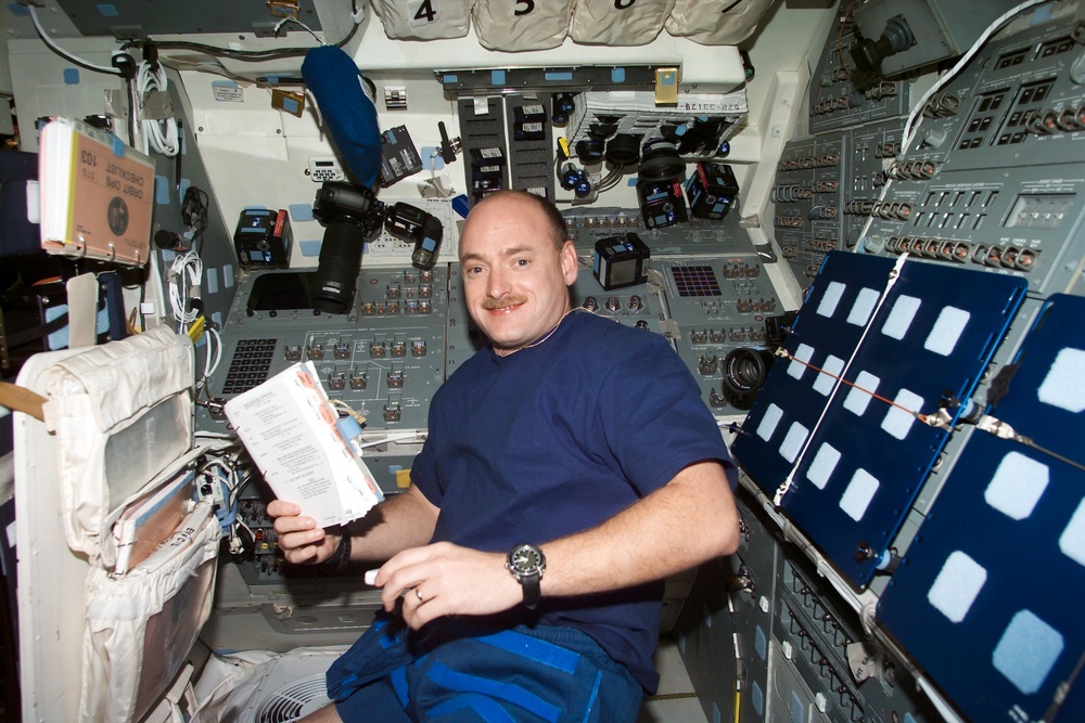 Plt Kelly on flight deck with check list