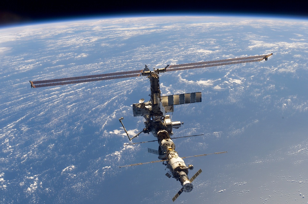 Aft - zenith view of the ISS taken during STS-110's undocking and final flyaround